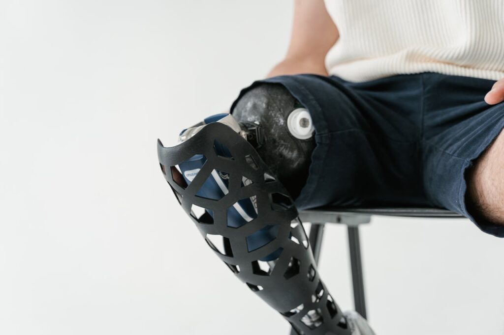 Close-up Shot of a Person Sitting on a Metal Chair